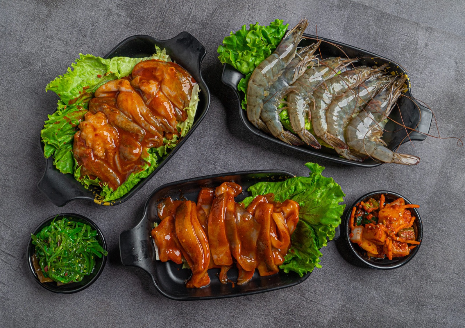 Fresh Meats & Seafood Marinated chicken shrimp and kimchi dishes at Gaja Korean BBQ